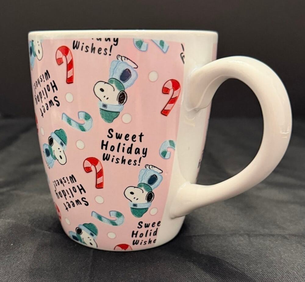 Peanuts Christmas ceramic coffee mug featuring Snoopy in a winter hat and scarf